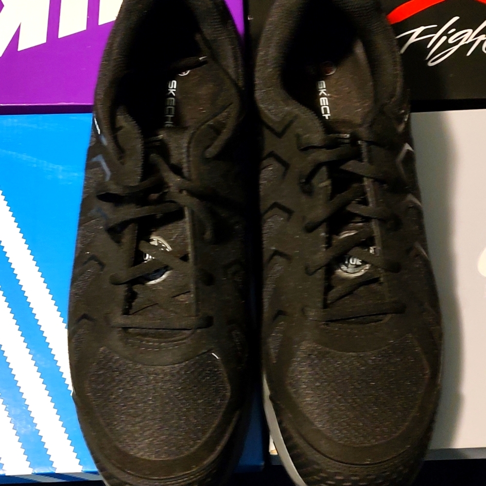 Sketchers work shoes size 12. Never worn.
